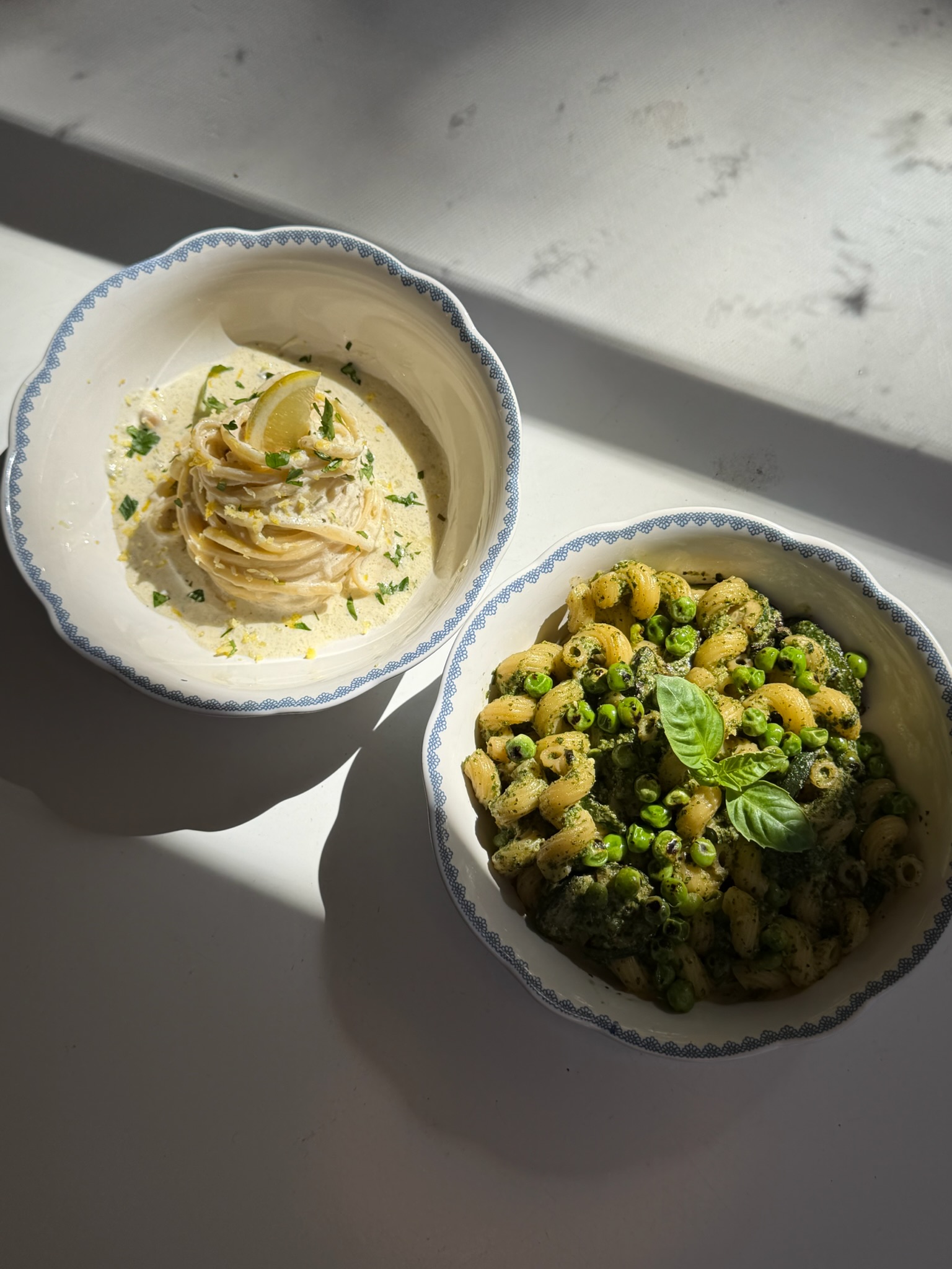 Two bowls of pasta, ready to enjoy