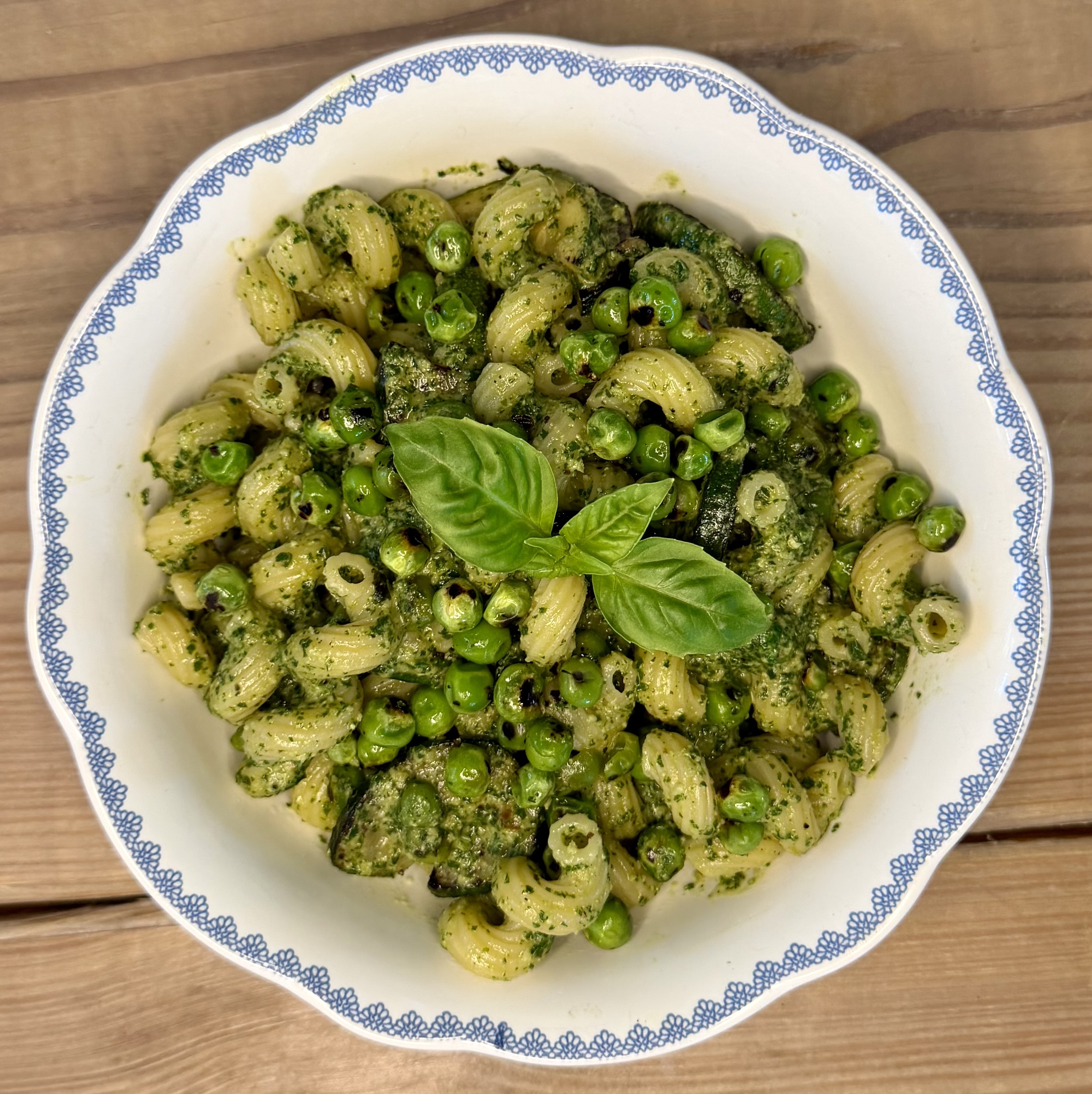 Garden pesto pasta with roasted zucchini and sweet peas